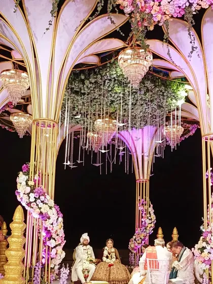 The stunning wedding mandap set up on the beach, a dream setting for a musical phere.