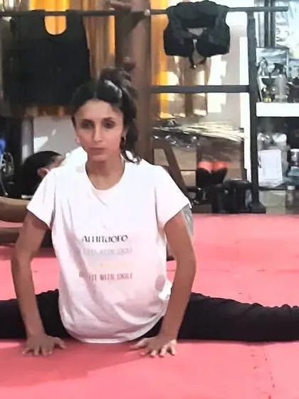 Flexibility is not a gift, it is a result of dedicated practice. This student demonstrates a full split, a testament to the scientific stretching methods we use in our training.