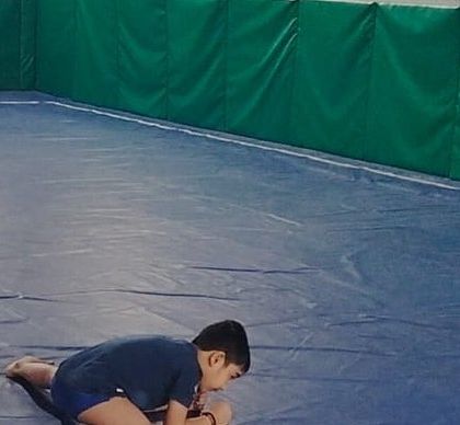 A moment of focus. Even our youngest gymnasts learn the importance of concentration and body awareness.