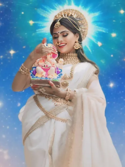 A creative shot from the Ganesha festival series, with the model as Goddess Parvathi holding a small Ganesha idol, adorned in my temple jewellery.
