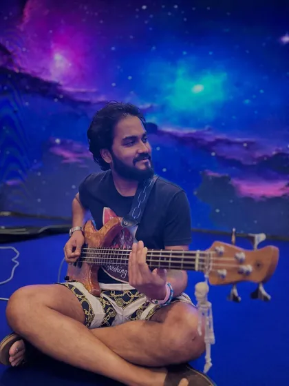 Our bassist is ready to rock against a cosmic backdrop. We love it when corporate events have cool and creative stage designs.