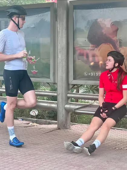 A casual chat at a bus stop, a common sight during our rides.