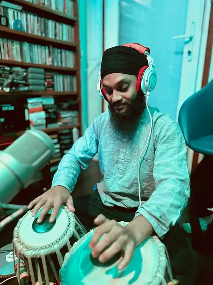 Another angle from the 'Sabadnaad' spiritual music recording. The studio is filled with books, showing a deep love for knowledge and art.