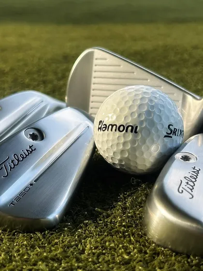 The newest gear always lands here first. A detailed shot of the all-new Titleist T-Series irons, showcasing the T100, T150, and T200 models ready for a fitting session.