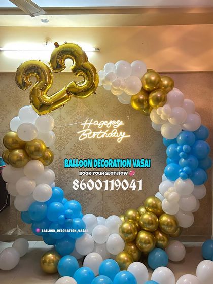 A 23rd birthday party with a blue, white, and gold balloon ring. The large foil numbers add a personalized touch.