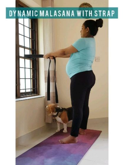 Using a yoga strap looped around a stable object is a great way to practice dynamic Malasana, allowing you to move in and out of the squat with support.