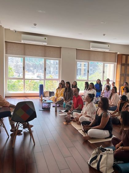 A group of students listening intently during a Gītā Sār Vichār session. These workshops are a space for deep listening and self discovery.