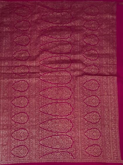 A close-up of the rich brocade pallu of our Bentex Banaras saree in a deep pink.