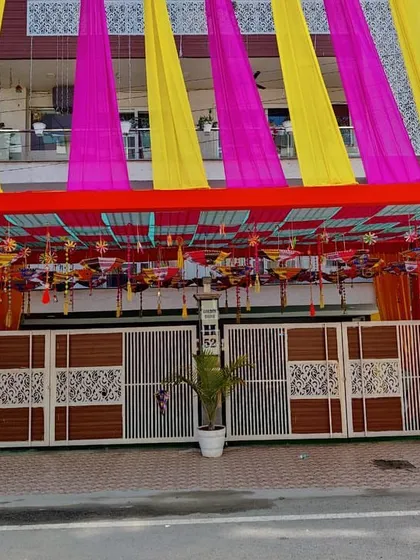 This angle shows how the entrance structure and facade draping create a grand and welcoming look for guests arriving at the event.