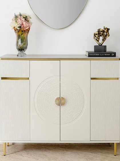 This cream-toned cabinet is where function meets quiet luxury. I designed it to be incredibly versatile, with generous internal storage for everything from crockery to linens. The clean lines, textured door details, and subtle gold accents make it a statement of refined, modern living.