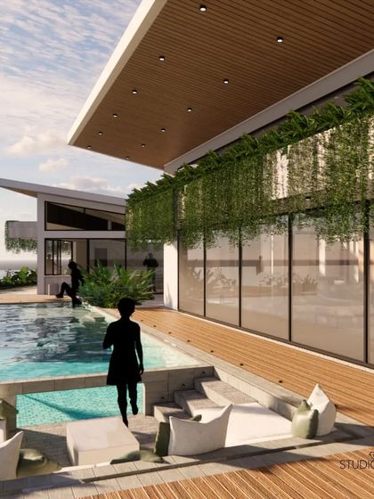 A sunken seating area is integrated into the wooden deck and infinity pool at the Pai Residence. This creates an intimate conversation pit where you can relax with your feet in the water, fully immersed in the waterfront experience.