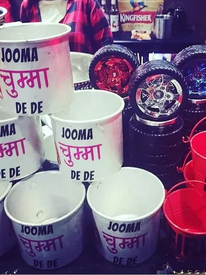 "Jumma Chumma De De!" These custom-printed buckets are a fun and thematic way to serve drinks or hold ice, bringing a classic Bollywood hit to life right at the bar.