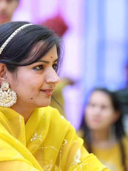 A sister's Haldi ceremony is a special moment. I designed this elegant sheesh phool and large chandbali earring set in white kundan to perfectly complement the vibrant yellow theme of the function.