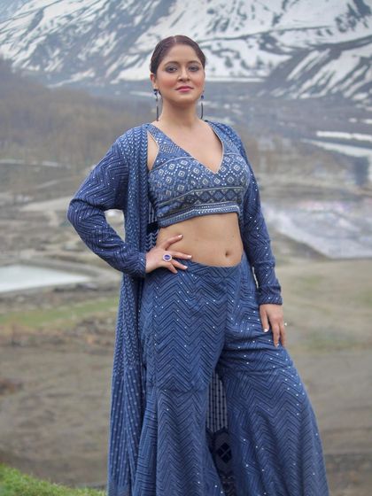 This pose shows the versatility and comfort of our Indo-Western outfits.