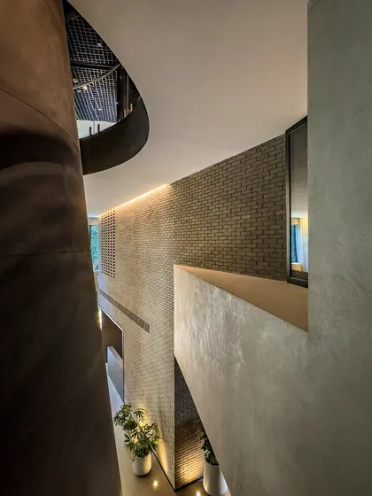 This perspective within the BCG HQ highlights the verticality of the space, with different levels and walkways visible through the central void.