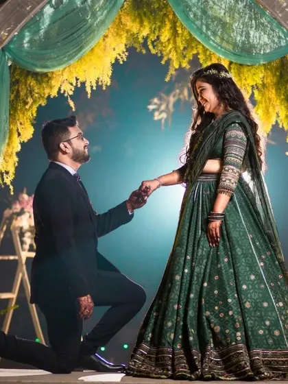 "Will you?" A moment suspended in time. I focus on creating a dramatic, cinematic feel for your most pivotal memories, ensuring the grandeur of the question is matched by the beauty of the photograph. This is a core memory from a Delhi wedding engagement.