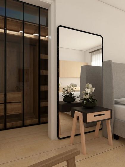 This bedroom features a walk-in wardrobe with dark-framed glass doors, creating a seamless transition from the Scandinavian-themed sleeping area. It's a perfect example of minimalist elegance and modern comfort.