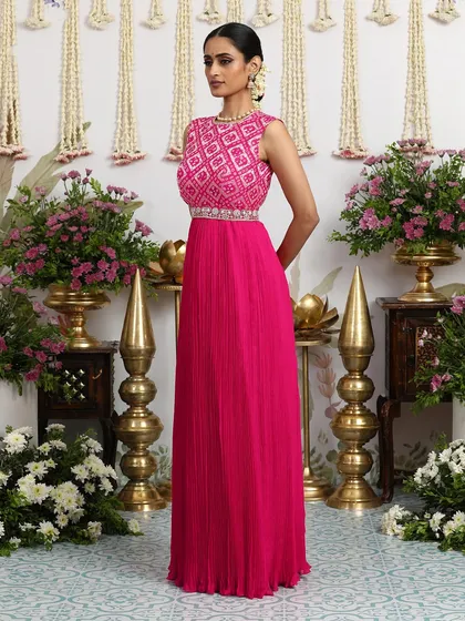 The elegant silhouette of the pink gown is perfect for dancing the night away at a sangeet or reception.
