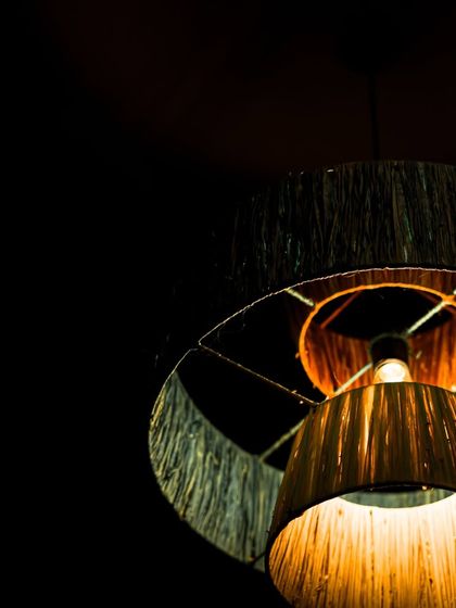 An angled view from below the lit fiber lamp, showing how the light is diffused through each tier. This design creates a soft, cascading glow.