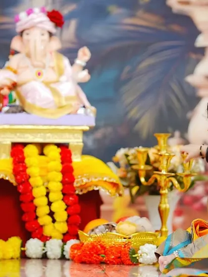 A curious glance from our little devotee. This shot captures a quiet, candid moment amidst the vibrant colors of the Ganpati festival theme.