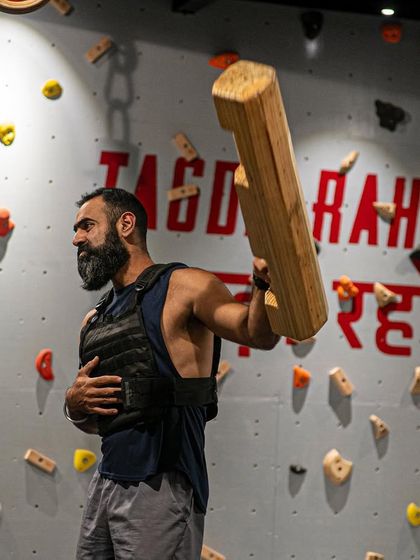 A shot of me working with the Samtola while wearing a weighted vest to increase the intensity. This tool is perfect for building brute strength and conditioning.