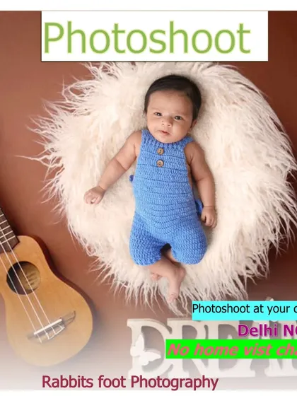 A promotional image with a baby and a guitar, advertising at-home photoshoots with no home visit charges.