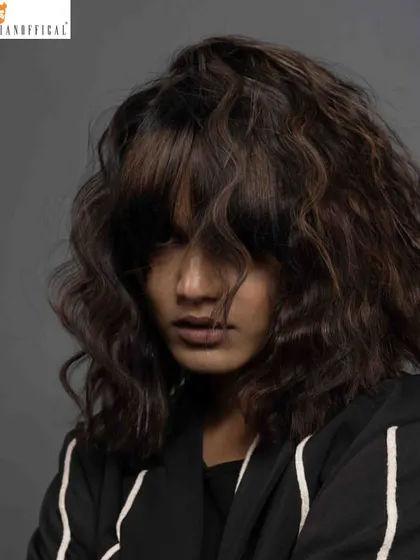 This look is all about hair texture. Created for a Schwarzkopf Professional shoot, this style features messy, lived-in waves and a heavy fringe, giving it a modern and edgy feel.