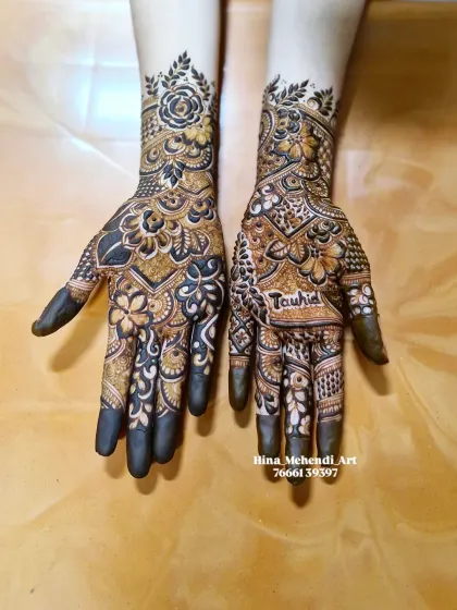 Another view of the floral design with the groom's name 'Tauhid' clearly visible, showcasing the blend of bold patterns and personalization.