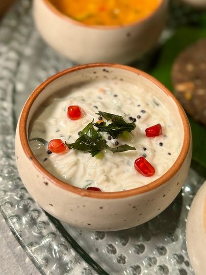 A cooling pomegranate raita from our Navratri Thali. This refreshing side dish provides a perfect balance to the richer, spicier curries on the platter.