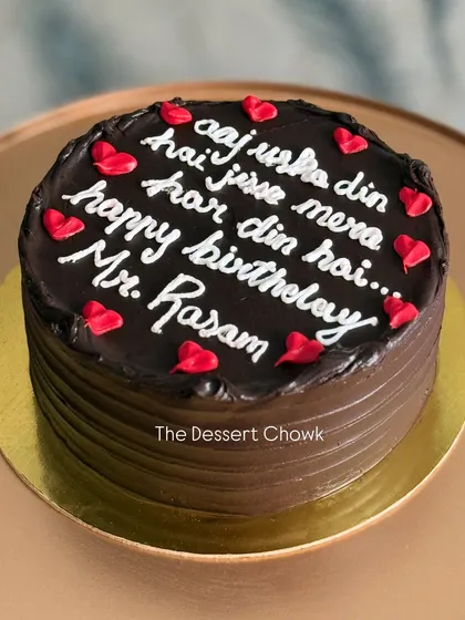 A custom Dutch Chocolate cake with a fun, romantic message written in Hindi.