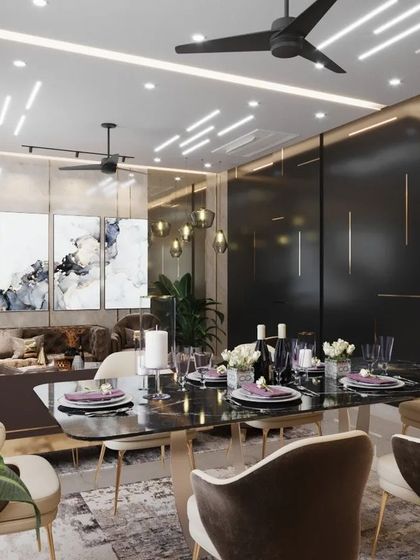 A view of the drawing and dining space in an Agra residence, showcasing a moody and sophisticated aesthetic. The dark feature wall with brass inlays provides a dramatic backdrop for the dining table, while abstract art adds a modern touch.