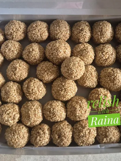 A large box of Til Laddoos, perfect for sharing with family. The sesame seeds and jaggery create a classic flavor combination that is both healthy and satisfying.