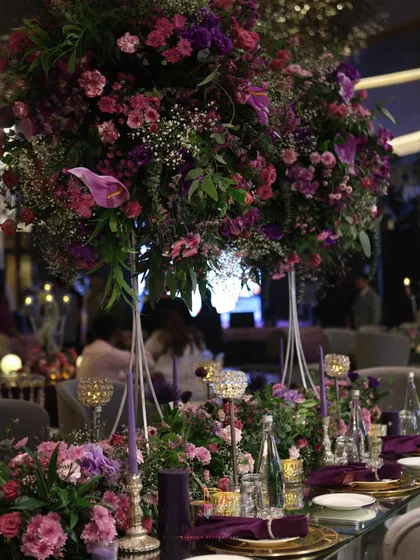 A tablescape that’s serving pure opulence. Deep purples, towering floral arrangements, and glowing crystal accents created a dining experience that felt both intimate and incredibly grand.