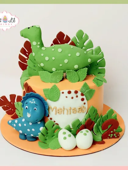 A roar-some cake for a dinosaur-themed second birthday. This creation features adorable, handcrafted fondant dinosaurs, edible eggs, and lush jungle leaves, transporting the party to a prehistoric wonderland.