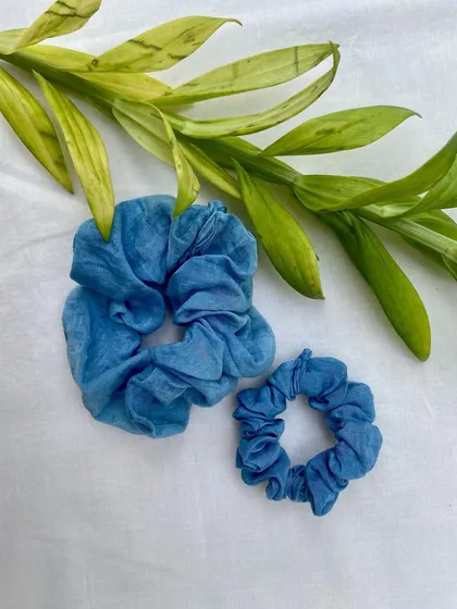 Another styling of the indigo-dyed scrunchies. They are a simple, sustainable accessory to add a pop of color to your look.