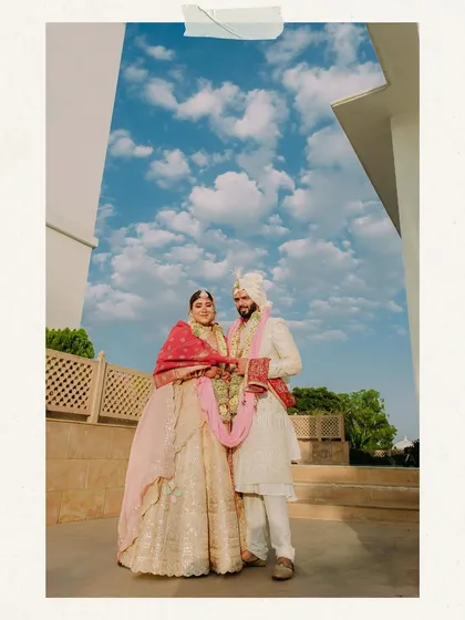 An epic portrait for an epic celebration in Udaipur. We use the grandeur of destination wedding locations to frame our couples, creating stunning, memorable images against dramatic skies and architecture.