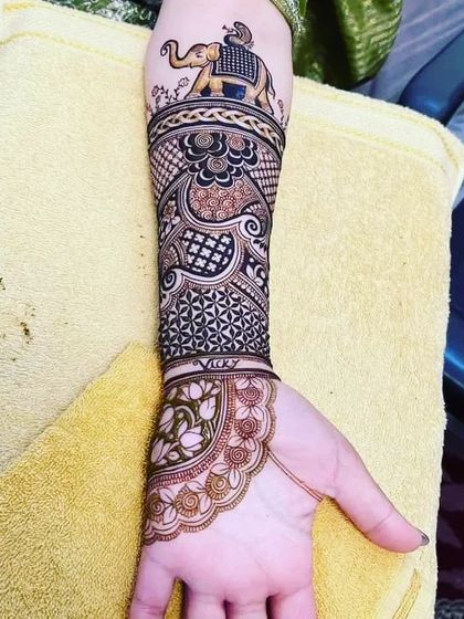 The full arm design featuring the elephant at the top, flowing into a mix of modern and traditional patterns.