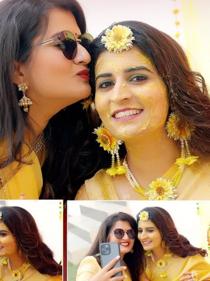 A sweet moment between the bride and a friend taking a selfie during the Haldi ceremony. We capture these small, personal interactions that tell the story of your day.