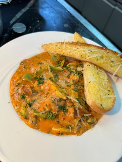 Food is art. A close-up of a delicious pasta dish from my collaboration with Crowne Plaza, focusing on the presentation and quality of the food.