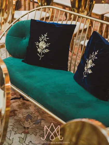 More examples of bespoke cushions, featuring delicate floral embroidery on rich velvet, adding a layer of luxury to the seating.