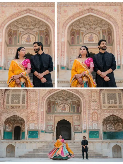 Amit and Sakshi's pre-wedding shoot at the Ganesh Pol gate of Amer Fort, featuring their vibrant traditional outfits against the intricately painted walls.