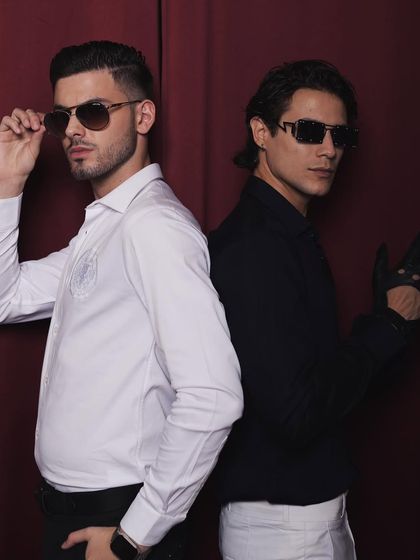 For the menswear brand Cairon, I styled this "Old Money Meets Young" campaign. This shot features two models in contrasting sharp white and black shirts, creating a classic, sophisticated look.