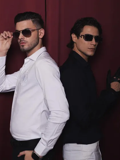 For the menswear brand Cairon, I styled this "Old Money Meets Young" campaign. This shot features two models in contrasting sharp white and black shirts, creating a classic, sophisticated look.
