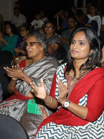 The audience applauds enthusiastically for our young performers. The live stage experience is invaluable for building student confidence.