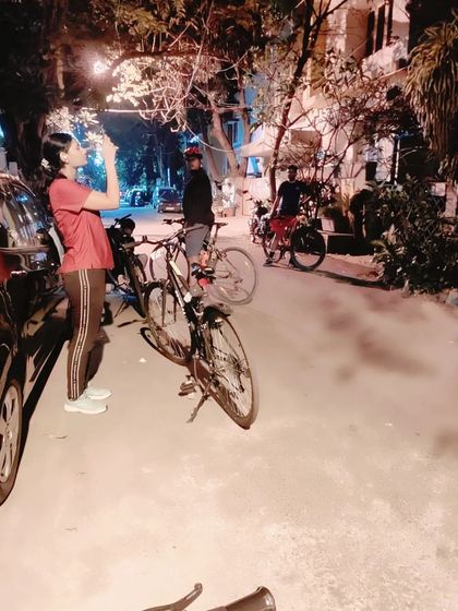 A rider stops to take a photo on a quiet Indiranagar street. Our rides are about capturing moments, sharing stories, and reclaiming our liberty to explore the city at night, safely as a community.