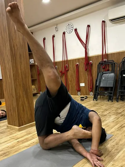 This student demonstrates great control in a complex twisting asana. Our classes provide the space and guidance to explore such advanced postures safely.