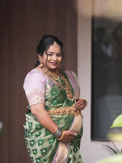 A portrait that speaks of confidence and joy. The unique color palette of this saree makes it a standout piece for any baby shower.