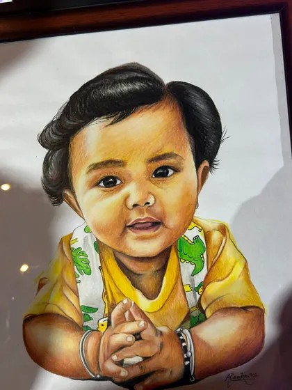 A close-up of a baby's portrait, framed and ready. I take great care in capturing the soft features and innocent expression of little ones.