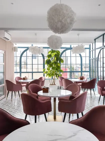For the Zoca rooftop café, we designed a vibrant, refreshing space for a young, modern clientele. The interior features large arched windows, plush velvet seating in pastel hues, and playful lighting to create an atmosphere that is both energetic and inviting, suitable for casual meetings or lively events.