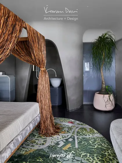 We integrated the bathroom and dry area into the master bedroom to create one large, open space. Arched doorways and continuous flooring connect the sleeping area to the vanity and sink, making the room feel expansive and luxurious.